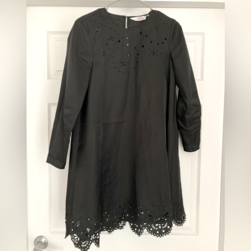 Little black dress with laser cut pattern.